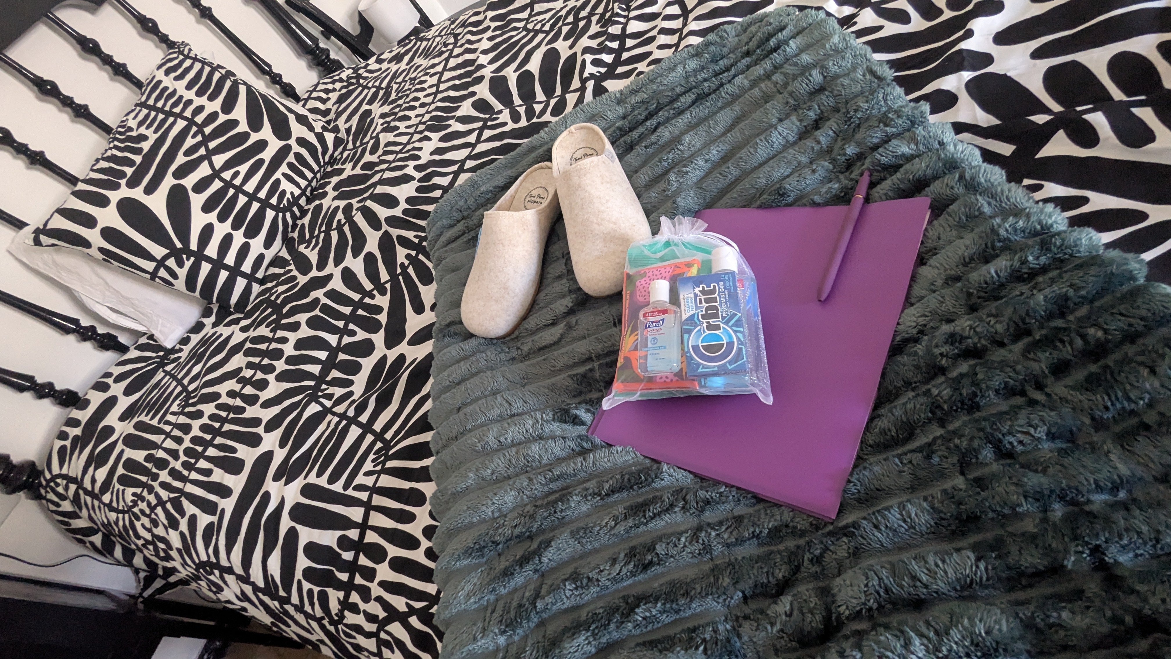 cozy bed, crisp sheets, comfy new Spanish slippers, and a welcome bag